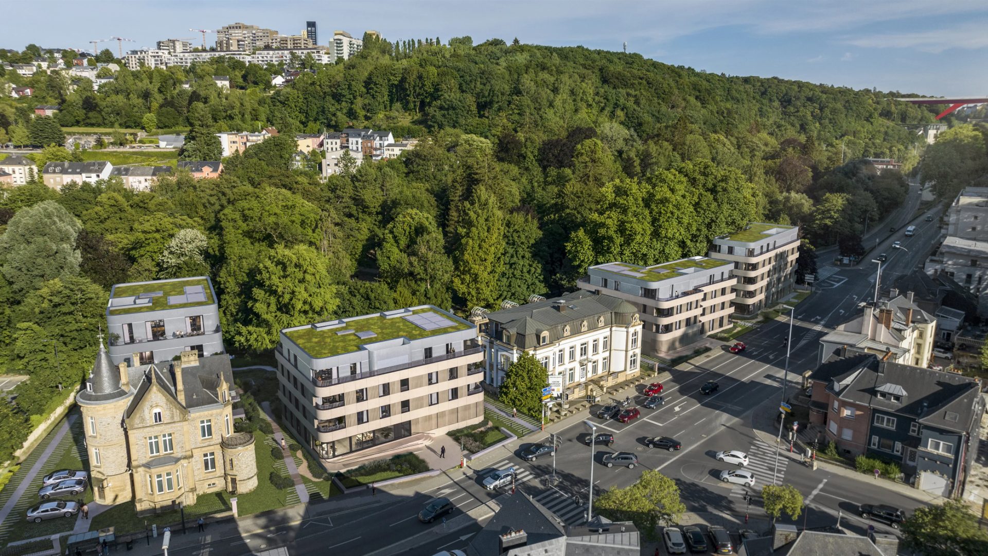 Aerial view of a residential project in its neighbourhood at dusk